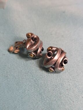 Silver-tone Swirl Clip-On Earrings with Black and Gold Accents